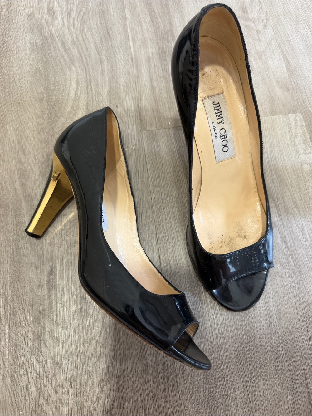 Jimmy Choo Black Patent Leather Peep-Toe Pumps with Gold Heel Accent